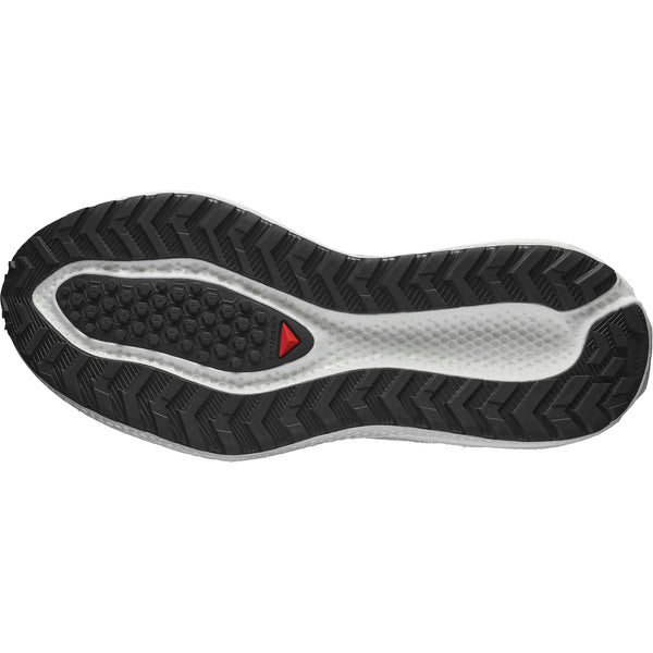 Billedet viser undersiden af Salomon Aero Glide 3 GRVL, Herre (White/Ftw Silver/Green Gecko), med en sort og hvid sål med sekskantede og zigzag-mønstre for greb samt en lille rød trekant nær midten.