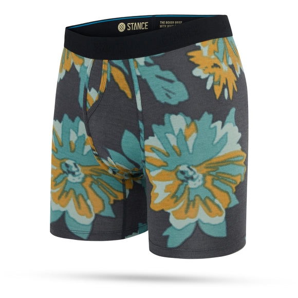 Stance Flora Scan Wholester herre boksershorts har et dristigt blomsterprint i blågrøn, gul og orange på mørkegrå med sort linning og STANCE-branding - et særsyn blandt performance-boksershorts herhjemme.