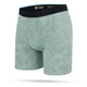 Stance Solid Green Wholester herre boksershorts har et subtilt bølget mønster, sort STANCE-logo linning og frontpose. Vises på en hvid baggrund.