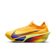 Nike Alphafly Next% 3 til mænd i Laser Orange/Indigo Burst-Citron Pulse har en fed orange farve, en lilla swoosh, en gul-grøn-magenta sål med gradient og en lavtskåret, soklignende strikoverdel.