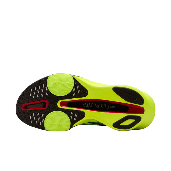 Billedet viser sålen på en Nike Alphafly Next% 3 løbesko herre i Multi-Color/Black-Volt-White med neongult, sort slidbanemønster, en rød accent, grønne grebscirkler og FLYTEPLATE trykt i midten.