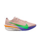 Nike Vaporfly Next% 4, Herre, Silt Red/Green Shock-Fire Pink "EK" har en lyserød overdel, fed grøn swoosh, orange-lilla gradientsål og "No Human is Limited" nær hælen, med responsiv ZoomX-skum vist fra en sideprofil.