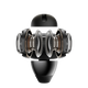 En sort Shokz Open Dots One True Wireless Open-Ear Hovedtelefoner er vist i tværsnit, så man kan se de symmetriske indvendige højttalere, spoler og komponenter på en almindelig hvid baggrund.