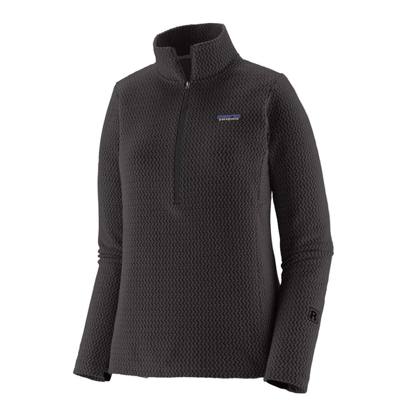Patagonia R1 Air Zip Neck, Dame i sort er en teknisk fleecetrøje til kvinder fremstillet af genbrugspolyester med vaffelstruktur og har et lille rektangulært Patagonia-logo på venstre bryst.