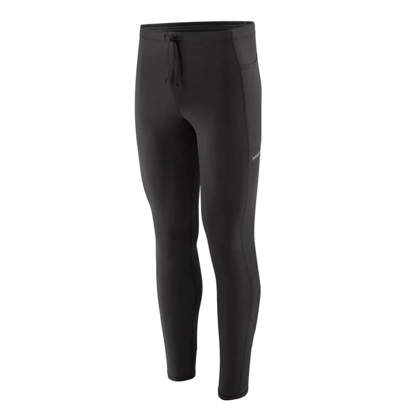 Patagonia Peak Mission Tights, Herre, i sort vises på en hvid baggrund. Disse lange sportsleggings har en linning med snøre og en lille sidelomme. De er fremstillet af elastisk, kropsnært materiale og er ideelle til sport eller fritidstøj.