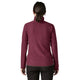 En person set bagfra, iført en dybrød Patagonia R1 Air Zip Neck, Dame, Berry Fig-fleece med et struktureret chevronmønster og sorte bukser.