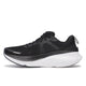 Saucony Guide 18 løbesko til kvinder i sort/hvid har en overdel i mesh, sorte snørebånd og en tyk hvid sål, set fra siden på en hvid baggrund.