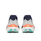 Et par Saucony Endorphin Speed 5 dame-løbesko, set bagfra, med lysegrå overdel, marineblå hælkraver, orange detaljer og hvide såler med turkise og teal-farvede elementer på undersiden. Disse løbesko i farven White/Navy er udstyret med den innovative Speedroll-teknologi, der sikrer en jævn og responsiv løbeoplevelse.