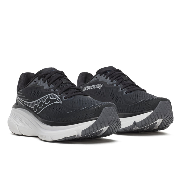 Saucony Guide 19 Herre i sort/sølv har overdel i mesh, snørelukning og tykke ydersåler, der giver stabilitet og effektiv stødabsorbering. Vist på en hvid baggrund med hvide såler.