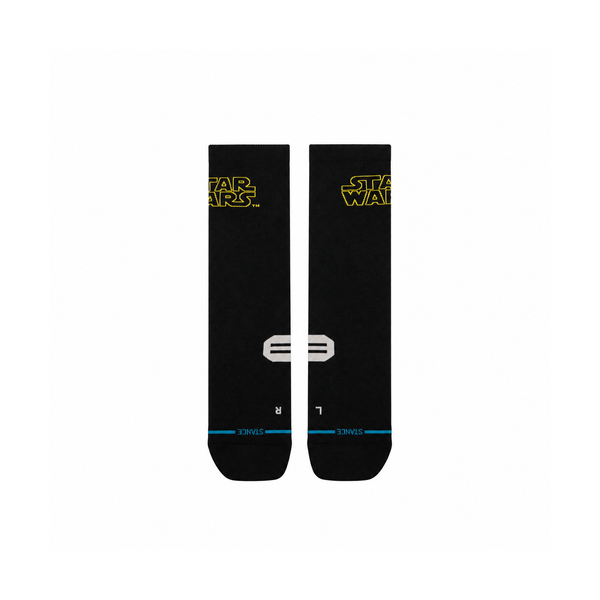 Stance SW Logo Light Crew-sokker i sort med gule Star Wars-logoer på manchetterne og L- og R-markeringer på fødderne.