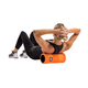 Klædt i sportstøj ligger en person med armene bag hovedet og bruger Trigger Point Grid Foamroller, Unisex, 006 Orange under den øverste del af ryggen til effektiv muskelmassage eller -træning.