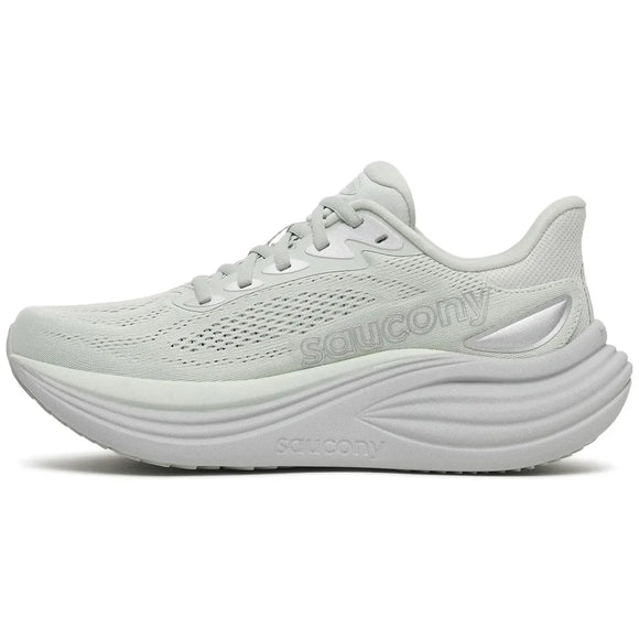 Saucony Triumph 24 Dame Cast er en lysegrå løbesko med overdel i mesh, snørelukning, tyk formet skumsål for optimal stødabsorbering og Saucony-logoer på siden og mellemsålen. Skoen er vist i profil, vendt mod venstre.