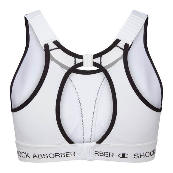 Shock Absorber Ultimate Run Bra Padded til kvinder i hvid har sort kant, et racerback-design med flere udskæringer i ryggen, justerbare stropper, fugttransporterende stof og branding for maksimal støtte.
