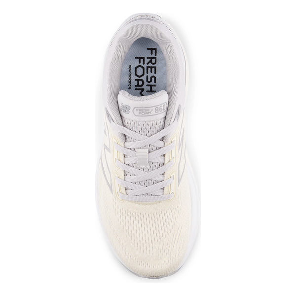 New Balance Freshfoam 860 V14 Dame i angora set oppefra, med cremefarvede snørebånd, mesh-overdel og synlig "FRESH FOAM"- og "860"-branding på indersålen for optimal stabilitet.