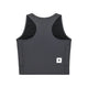 En antracitgrå Saysky W Combat Rib Crop Top til kvinder set bagfra, med brede skulderstropper, sorte mesh-sidepaneler og et lille hvidt rektangulært mærke med en sort stjerne nederst til højre på kanten.