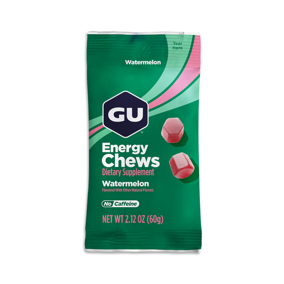 En grøn og pink pakke med GU Energy Chews, Watermelon flavor fra GU Energy, indeholder to tyggetabletter og er mærket No Caffeine - perfekt til energi under træning. Nettovægt: 60 g (2,12 oz).