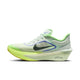 Nike Zoom Fly 6 Herre i Barely Green/Black Spruce-Volt Ice har et stort sort logo, gul sål, gennemsigtig mesh-overdel og tyk støddæmpende ZoomX-mellemsål, vist fra siden mod en almindelig hvid baggrund.