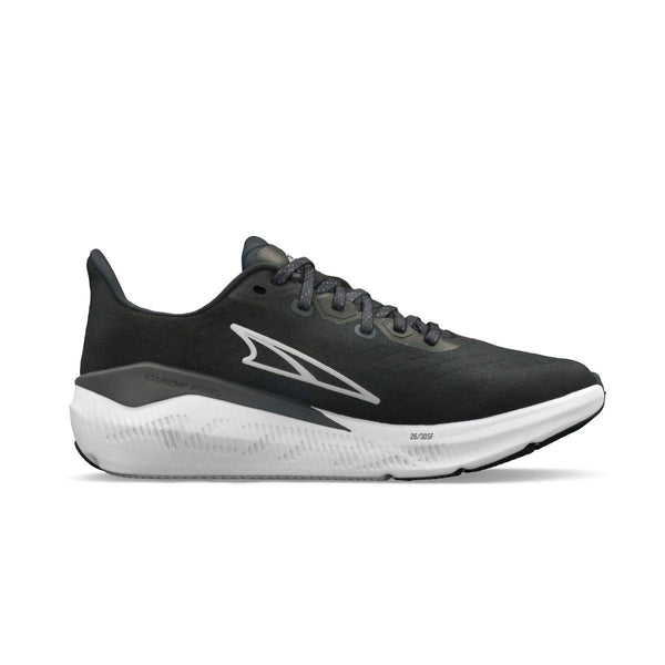 Altra Experience Form Dame i sort er en atletisk løbesko med hvid sål, hvidt logo på siden og sorte snørebånd, der er designet til komfort med FootShape-pasform. Vist i sideprofil mod en almindelig hvid baggrund.