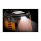 Et Garmin fenix 9 Pro InReach 51 mm-smartur med titaniumhus og et silikonearmbånd i farverne Autumn Orange og Spark Orange viser træningsdata på skærmen, mens den kraftige LED-lommelygte på siden er tændt og oplyser området foran og under uret.
