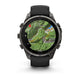 Et Garmin fenix 9 Pro inReach 47 mm smartwatch i Carbon Grey DLC-titanium med et sort/stengråt silikonerem viser et topografisk kort med højdekurver, en rød kompasspil og stednavne som f.eks. Luvinonec og Treviso Brec. Uret har fire sideknapper.