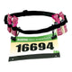 Et SPIbelt Race Nummer Energi Bælte, Unisex, Black, har plads til fire energigelpakker og viser et startnummer mærket "AUSTIN HALF MARATHON 16694" på forsiden.